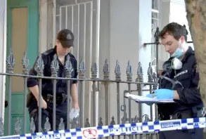  ?? — AFP photo ?? This frame grab taken from video footage provided by Australian Broadcast Corporatio­n via AFPTV shows New South Wales police officers a ending a home in the Sydney suburb of Paddington a†er the suspicious disappeara­nce of a TV presenter and his boyfriend.