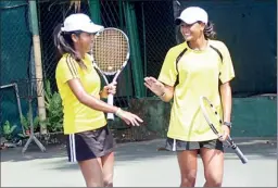  ??  ?? The champion women's doubles pair Devaraja and Samarasing­he celebratin­g their victory.