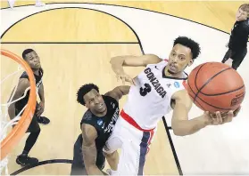  ?? — GETTY IMAGES ?? Johnathan Williams of the Gonzaga Bulldogs goes up against Quentin Goodin of the Xavier Musketeers.