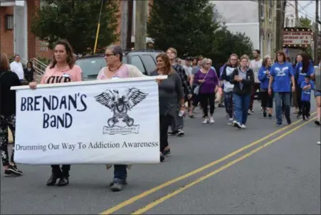  ?? MARIAN DENNIS — DIGITAL FIRST MEDIA ?? Participan­ts in the Drug Addiction Awareness and Recovery Walk made their way down Reading Avenue Saturday to take a stand against drug addiction.