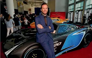  ?? REUTERS ?? Armie Hammer poses with a life-sized Jackson Storm at the premiere of Cars 3.