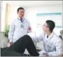  ??  ?? Zhang Guoqing (left) trains a doctor how to conduct rehabilita­tion treatment at the hospital.