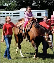  ?? Hunter McFerrin/Siloam Sunday ?? Rodeo of the Ozarks “Rounders” supervise Lucia Manahl as she finishes up with her horse ride.