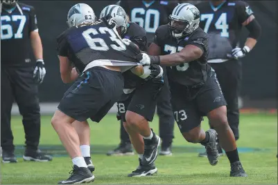  ?? THEARON W. HENDERSON / GETTY IMAGES VIA AFP ?? Carolina Panthers offensive tackle Michael Oher ( right) participat­es in drills on Wednesday ahead of Sunday’s Super Bowl against the Denver Broncos in San Francisco.