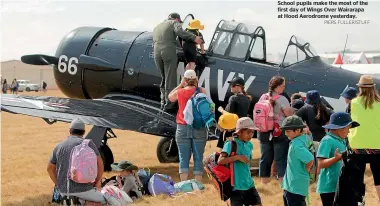  ?? PIERS FULLER/STUFF ?? School pupils make the most of the first day of Wings Over Wairarapa at Hood Aerodrome yesterday.