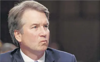  ?? Jacquelyn Martin / Associated Press ?? President Donald Trump’s Supreme Court nominee, Brett Kavanaugh, listens to a question on the third day of his Senate Judiciary Committee confirmati­on hearing Thursday.