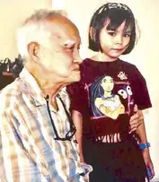  ??  ?? Franz Arcellana with the author Krip Yuson’s daughter, Mirava, on a day when Franz joined a PLAC meeting at Krip’s home, circa mid1990s.