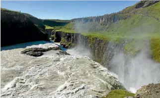  ??  ?? Gullfoss is one of the major stops on the Golden Circle, gouging through an otherwise flat plain.