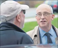  ?? CP PHOTO ?? Nova Scotia NDP Leader Gary Burrill, right, chats with Howard Epstein, a senior adviser and former MLA, as he makes a campaign stop in Halifax earlier this week. The provincial election will be held Tuesday, May 30.