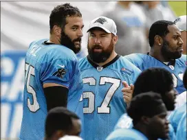  ?? PHOTOS BY DAVID T. FOSTER III / CHARLOTTE OBSERVER ?? Carolina Panthers center Ryan Kalil (67) talks with his teammate and younger brother, offensive tackle Matt Kalil, during Panthers training camp last month at Wofford College in Spartanbur­g, S.C.