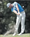  ?? JOHN BAZEMORE/ THE ASSOCIATED PRESS ?? Dustin Johnson hits a shot on the second fairway Friday during the second round of the PGA Tour Championsh­ip at East Lake Golf Club in Atlanta. He shot a 3-underpar 67 for a 7-under 203 total and a onestroke lead.