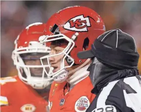  ?? DAVID EULITT/GETTY IMAGES ?? Chiefs quarterbac­k Patrick Mahomes had to change helmets after his original one was damaged in a collision in the third quarter.