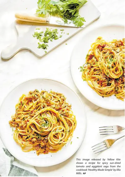  ?? AP ?? This image released by Yellow Kite shows a recipe for spicy sun-dried tomato and eggplant ragu from the cookbook ‘Healthy Made Simple’ by Ella Mills.