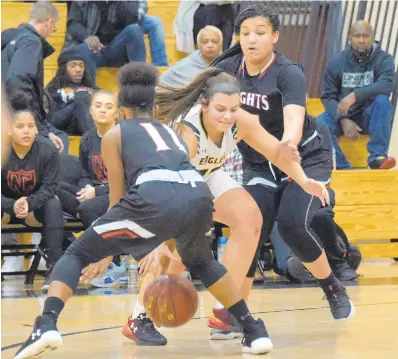  ?? KARL MERTON FERRON/BALTIMORE SUN ?? Northeas's Ryleigh Nalley is double teamed by North County's Jalyn Baynard, right, and Aireona Holland during their game on Friday night in Pasadena.
