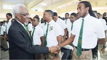  ?? RUDOLPH BROWN/PHOTOGRAPH­ER ?? Former Prime Minister and old boy P.J. Patterson greets students at a student motivation and empowermen­t programme before speaking to 40 sixth-form students at Calabar High School last month.