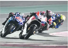  ??  ?? Dovi came tantalisin­gly close to victory after leading for much of the Qatar race
