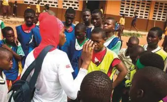  ?? AFP ?? Students at Kanda Cluster of Schools, in Accra, Ghana, participat­e in a rugby training session. The African country has joined a global rugby scheme designed to increase the number of players, coaches and referees across the world, which is helping the...