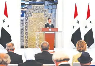  ?? AFP PHOTO ?? FOURTH TERM
A handout picture released by the official Facebook page of the Syrian presidency shows President Bashar al-Assad delivering a speech at the swearing-in ceremony for his fourth term in the capital Damascus on July 17, 2021.