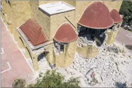  ?? NIKIFOROS PITTARAS / ASSOCIATED PRESS ?? A Greek Orthodox church on the Greek island of Kos sits damaged Friday after a powerful early morning earthquake. The quake also struck the nearby Turkish resort town of Budrum, injuring hundreds.