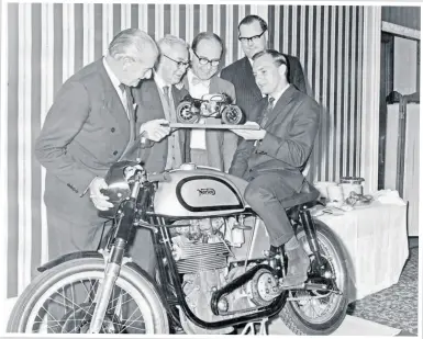  ?? ?? After his 1961 Senior TT win, Hailwood is presented with the model Norton, which the family still has.