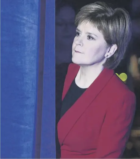  ??  ?? 0 First Minister Nicola Sturgeon waits to go on stage at the first day of the SNP conference in Glasgow yesterday