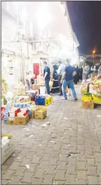  ??  ?? Items displayed on the ground outside the market and oil sold for 500 fils.