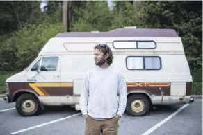  ?? BEN NELMS/BLOOMBERG ?? Phil Bonham, a ski patroller at Vail Resorts Inc. Whistler-Blackcomb, stands outside the camper van he lives in because he can’t afford a room in the town despite earning a decent living.