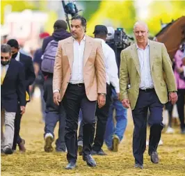  ?? JULIO CORTEZ AP ?? Owner Amr Zedan (center) went through DQ of Medina Spirit, trainer Bob Baffert’s ban and the horse’s death. He returns to Churchill Downs with Taiba.