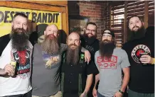  ?? GAVIN YOUNG ?? Competitor­s and organizers show off their beards before the third-annual Alberta Beard and Moustache Championsh­ips at the Palomino Smokehouse on Saturday, a fundraiser for Ronald McDonald House.