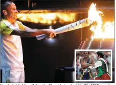  ??  ?? Vanderlei de Lima lights the Olympic torch att ththe RiRio 2016’ openingi ceremony. (Inset) Neil Horan’s infamous tackle on the athlete in the closing stages of the Athens 2004 Olympic marathon.