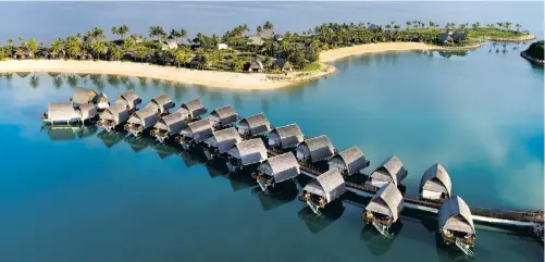  ??  ?? Aerial view of Fiji’s first overwater resort, Marriott Fiji Momi Bay.
