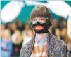  ?? ANTONIO CALANNI/ASSOCIATED PRESS FILE PHOTO ?? A model wears a creation as part of the Gucci women’s Fall/ Winter 2018-19 collection, presented during the Milan Fashion Week in Milan, Italy, last year. The Gucci design, reminiscen­t of blackface, prompted backlash from the public.