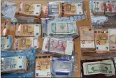  ??  ?? €135,000 in various currencies was recovered during the house search.