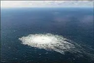  ?? Associated Press ?? A large disturbanc­e in the sea can be observed off the coast of the Danish island of Bornholm on Tuesday following a series of unusual leaks on two natural gas pipelines running from Russia under the Baltic Sea to Germany have triggered concerns about sabotage.