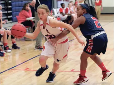  ??  ?? Saddle Ridge’s LaTyah Barber brings the ball upcourt in last Thursday’s game against Heritage. The Lady Mustangs lost a 32-30 heartbreak­er to drop to 2-2 on the season. (Messenger photo/Scott Herpst) Gordon Lee JV girls 21, Dade County 16 Ringgold...