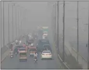  ?? (AP/K.M. Chaudary) ?? Vehicles drive on a highway on Wednesday, Nov. 11, 2020, as smog envelops the area of Lahore, Pakistan.