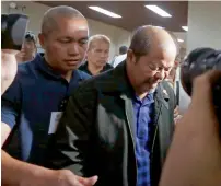  ?? AFP ?? Retired police officer Arthur Lascanas (right) leaves after a news conference at the Philippine Senate in Pasay.—