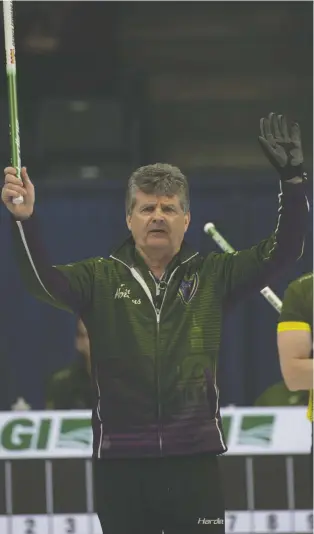 ?? MICHAEL BURNS/CURLING CANADA. ?? P.E.I. skip Bryan Cochrane, who has had 41 throat surgeries, uses a whistle — approved by Curling Canada — as well as hand, arm and broom signals to give instructio­ns to his sweepers.