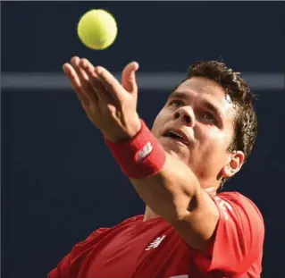  ?? NATHAN DENETTE, THE CANADIAN PRESS ?? Milos Raonic of Canada serves the ball against Yen-Hsun Lu of Taiwan during second-round Rogers Cup tennis action in Toronto on Wednesday. Raonic won, 6-3, 6-3 at the York University tennis centre.