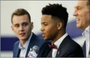  ?? MATT SLOCUM — THE ASSOCIATED PRESS ?? Philadelph­ia 76ers’ draft picks Markelle Fultz, center, and Anzejs Pasecniks, left, speak along with team president Bryan Colangelo during a news conference at the team’s NBA basketball training complex Friday in Camden, N.J.