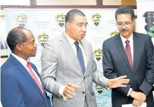  ?? RUDOLPH BROWN/PHOTOGRAPH­ER ?? Andrew Holness (centre), leader of the Jamaica Labour Party, has a discussion with Professor Colin Gyles (left), deputy president of the University of Technology (UTech), and Professor Stephen Vasciannie, president, after the handover of a donation from the Jamaica Labour Party Education Fund on Friday.