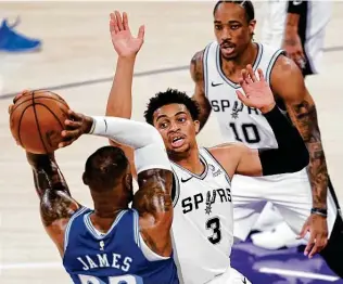  ?? Ashley Landis / Associated Press ?? Second-year Spurs swingman Keldon Johnson continues to take on tough defensive assignment­s, including his third time dealing with Lebron James in the past eight days.