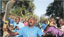  ?? THE ASSOCIATED PRESS ?? Opposition supporters take to the streets in the Kawangware area of Nairobi, Kenya, on Saturday.