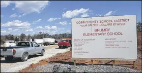  ?? HENRY TAYLOR / AJC ?? The sign at the constructi­on site at Terrell Mill Road and Greenwood Trail advertises where Cobb County SPLOST tax dollars are being put toward in Marietta. In just a week, Cobb County residents will vote whether to extend its education SPLOST.