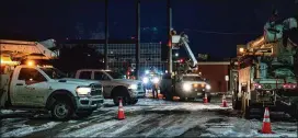  ?? ELI HARTMAN/ODESSA AMERICAN VIA AP ?? An Oncor Electric Delivery lineman crew works on repairing a utility pole that was damaged by the winter storm in February that passed through Odessa, Texas.