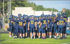  ?? AIMEE BIELOZER — FOR THE MORNING JOURNAL ?? Olmsted Falls huddles before its scrimmage against visiting Willoughby South on Aug. 22, 2019.