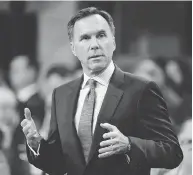  ?? ADRIAN WYLD / THE CANADIAN PRESS ?? Finance Minister Bill Morneau wants to enhance competitiv­eness without tax cuts, sources say.