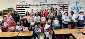  ?? COURTESY ?? Fifth graders at Carmel Elementary in Woodstock show off their service project: “bedtime boxes” and letters filled with helpful suggestion­s for other kids who have trouble getting to sleep.