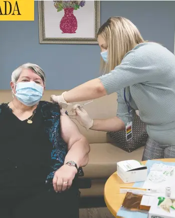  ?? ANDREW VAUGHAN-POOL / THE CANADIAN PRESS ?? Nurse Amanda Parsons administer­s a dose of Moderna's COVID-19 vaccine to Ann Hicks at the Northwood care facility in Halifax on Monday. According to a new poll, 57 per cent of respondent­s think the Trudeau government is doing a good job with Canada's vaccine rollout.