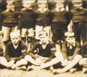  ??  ?? A young George H.W. Bush, center, is shown in the 1933-1934 Greenwich Country Day class photo, displayed as part of the President George H.W. Bush Memorabili­a Display at the Greenwich Historical Society in Greenwich.